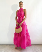 Abito maxi elegante con collo halter e vita legata per donne.
