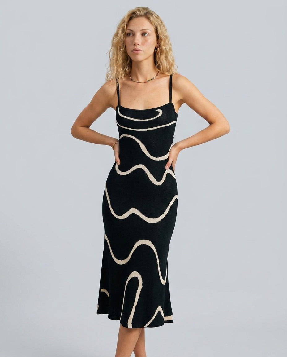 Abito midi a maglia con orlo sirena elegante in nero.